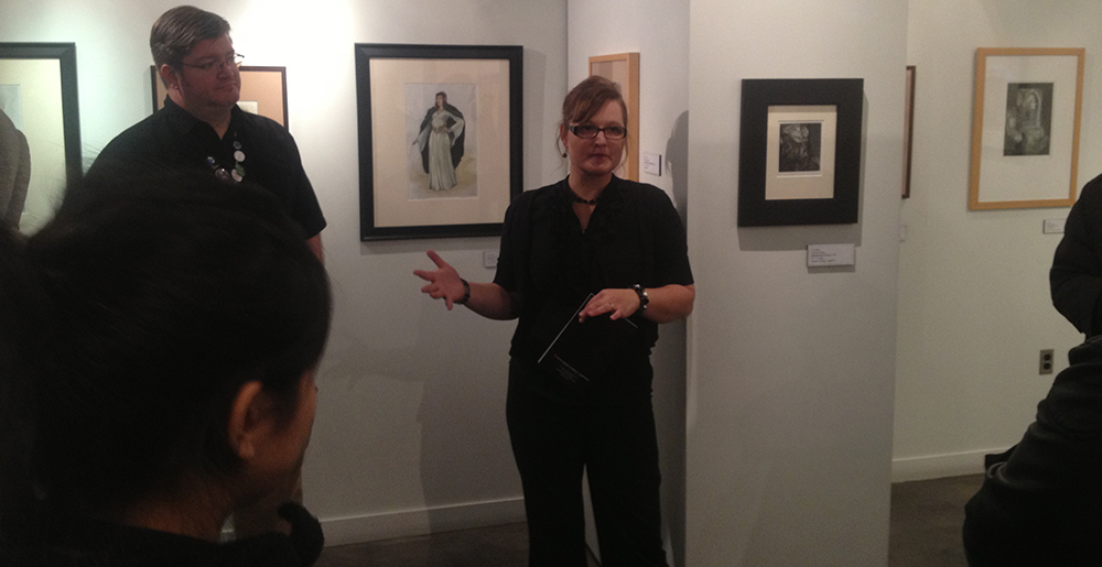 Photo of Kandra talking about artwork